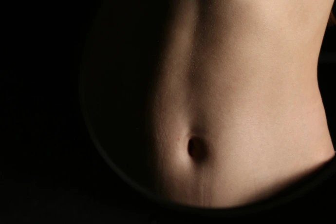 A close-up of a person's abdomen.